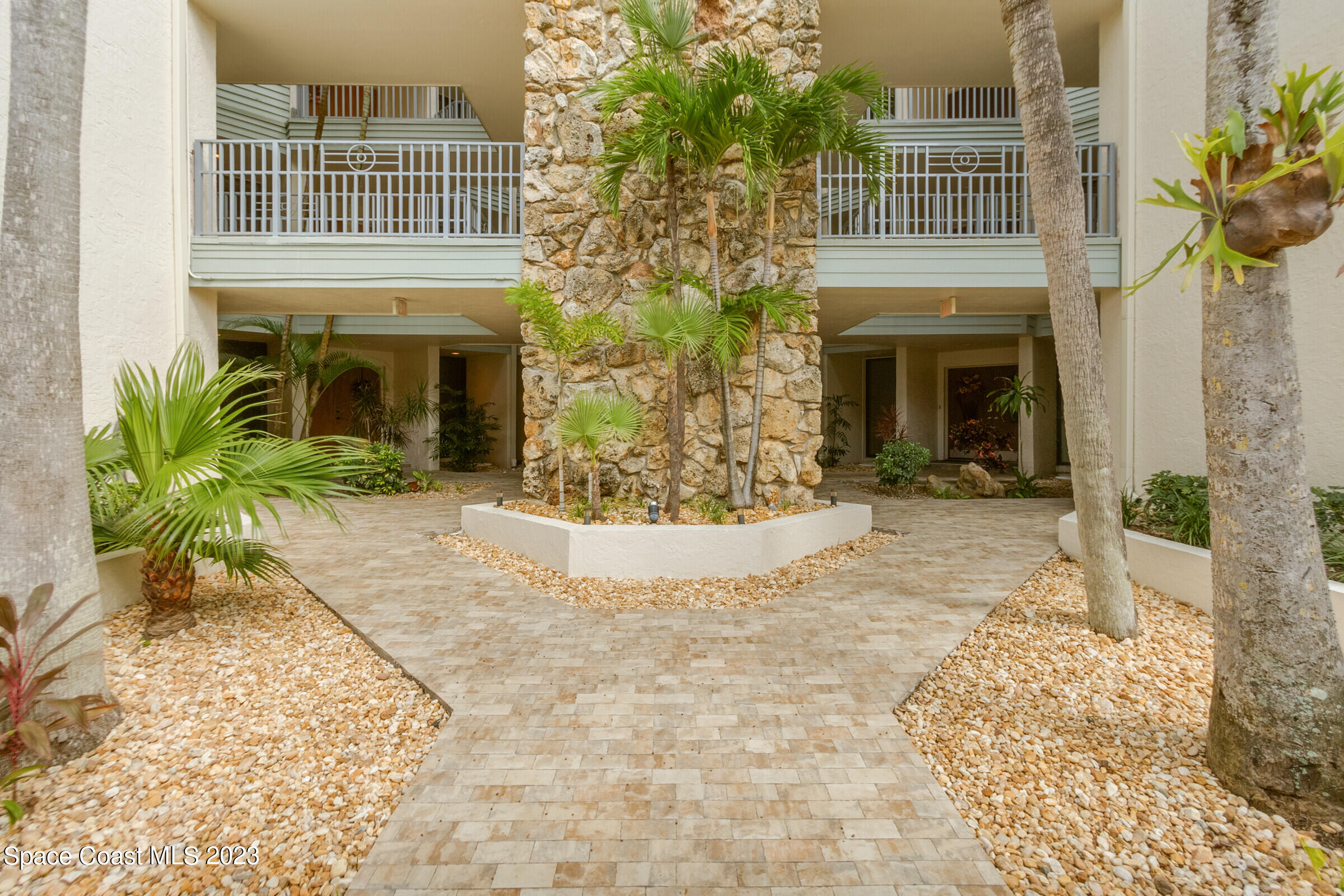 700 Wave Crest Avenue, Unit 202 Indialantic, FL 32903 - Photo 24 of 29 a view of house with yard and outdoor space