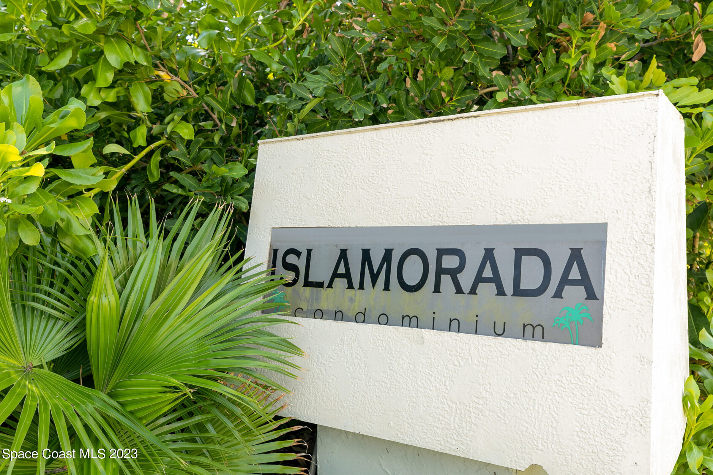 700 Wave Crest Avenue, Unit 202 Indialantic, FL 32903 - Photo 25 of 29 a close up of a street sign