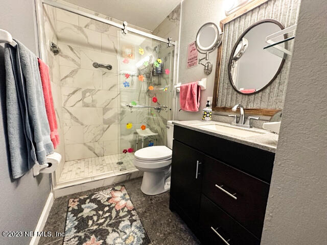 1504 Raiford Road Starke, FL 32091 - Photo 11 of 24 a bathroom with a sink vanity mirror and toilet