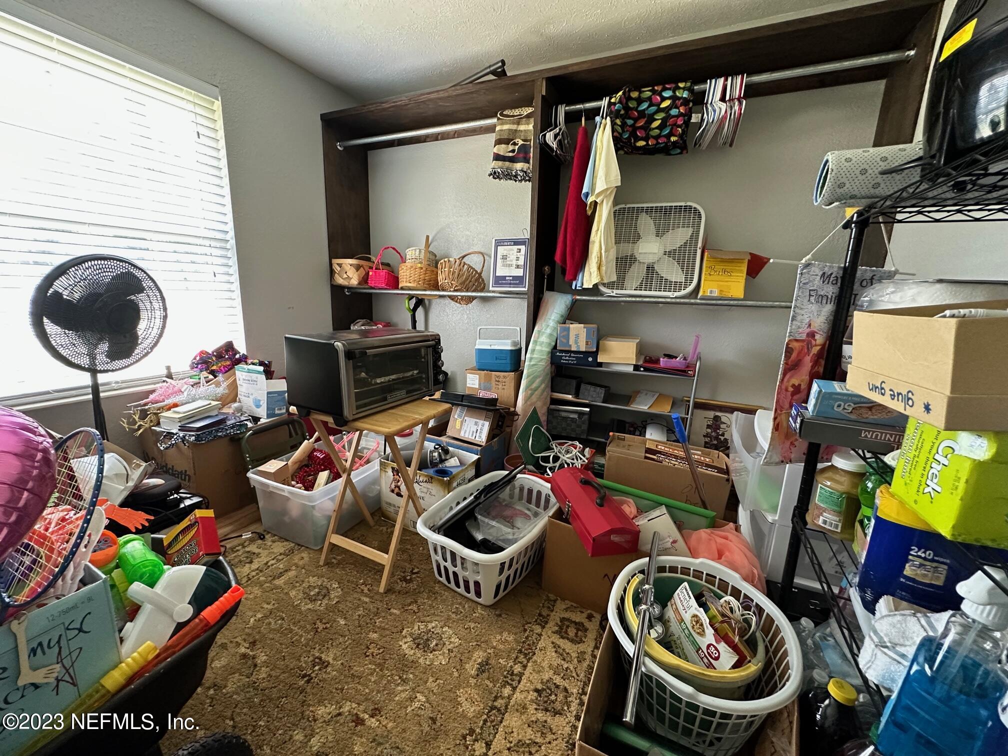 1504 Raiford Road Starke, FL 32091 - Photo 13 of 24 a room with lots of stuff and toys