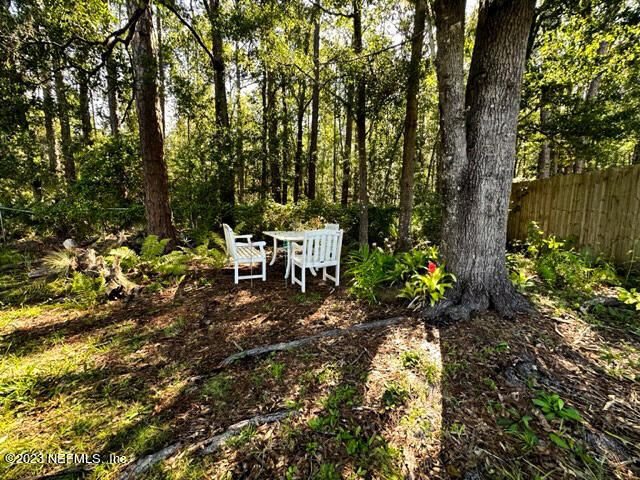 1504 Raiford Road Starke, FL 32091 - Photo 18 of 24 a backyard of a house with table and chairs