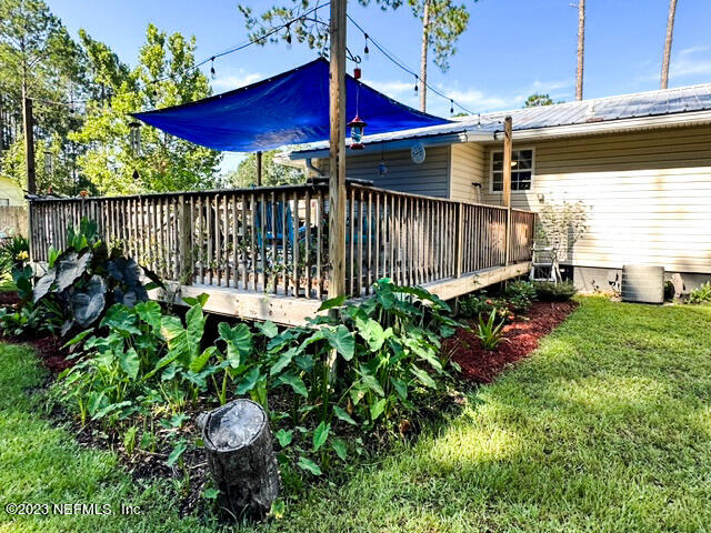 1504 Raiford Road Starke, FL 32091 - Photo 20 of 24 a view of a house with a backyard