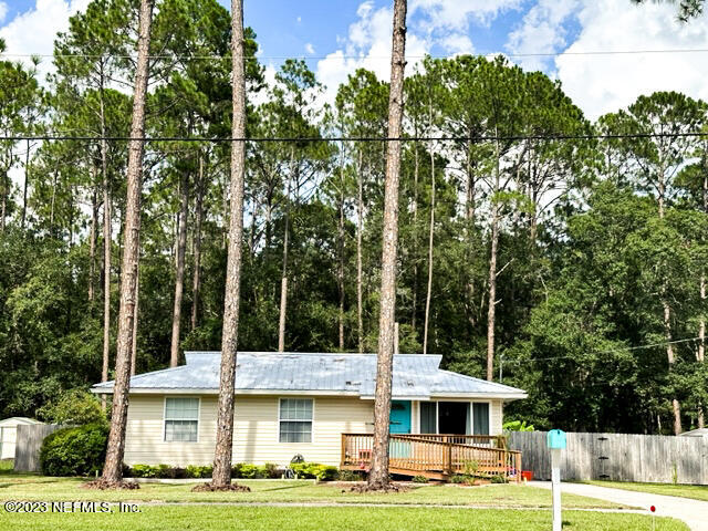 1504 Raiford Road Starke, FL 32091 - Photo 2 of 24 a front view of a building with trees