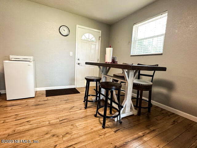 1504 Raiford Road Starke, FL 32091 - Photo 5 of 24 a view of a dining room with furniture and wooden floor