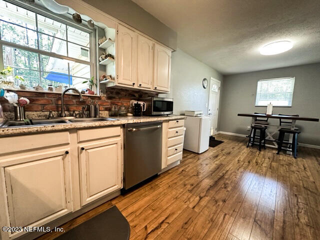 1504 Raiford Road Starke, FL 32091 - Photo 7 of 24 a kitchen with a sink appliances and cabinets