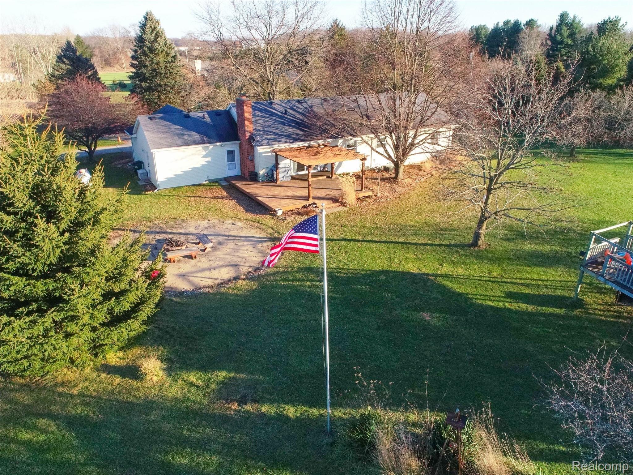 270 South Kern Road Fowlerville, MI 48836 - Photo 12 of 55 Back Of Home With Deck & Pergola!
