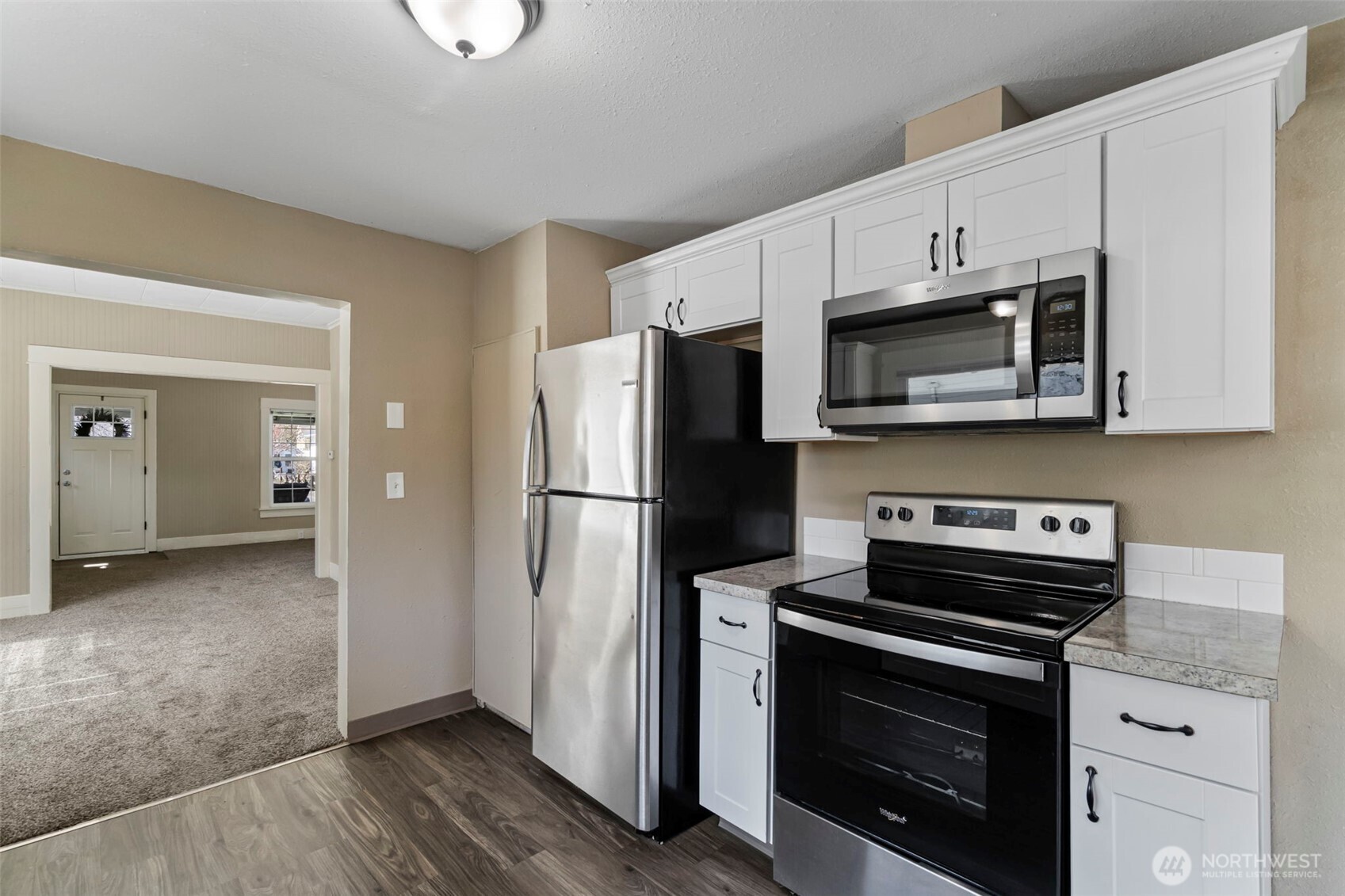 714 G Street Centralia, WA 98531 - Photo 16 of 40 a kitchen with stainless steel appliances a stove microwave and refrigerator