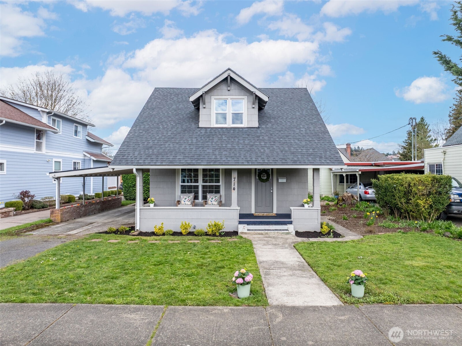 714 G Street Centralia, WA 98531 - Photo 39 of 40 a front view of a house with a yard and potted plants