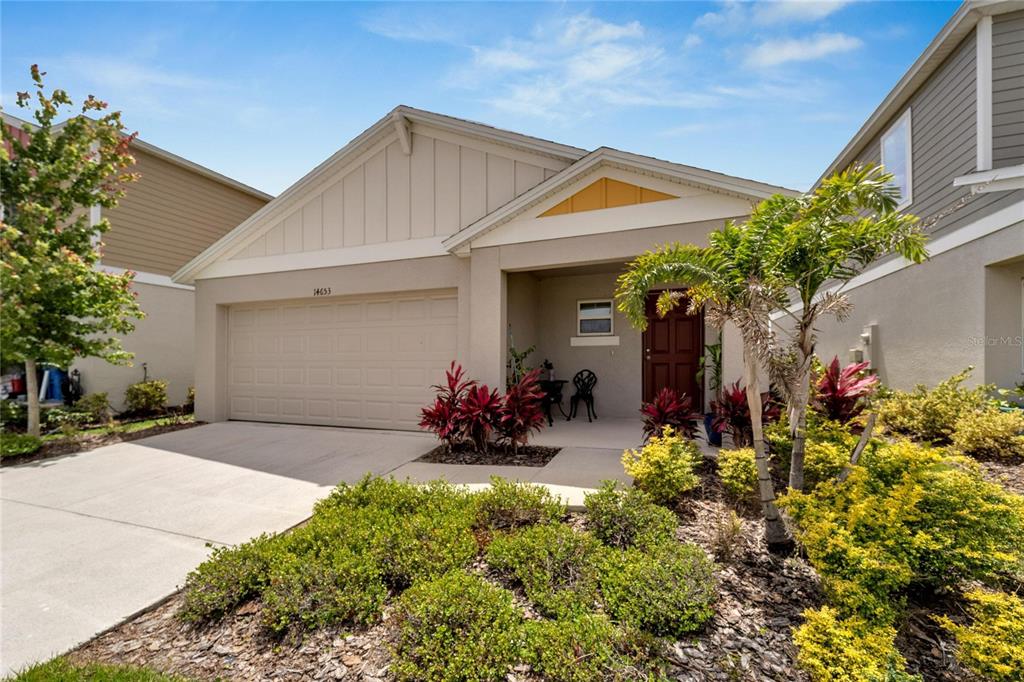 Beautifully landscaped and covered patio in the front is great for your morning coffee.