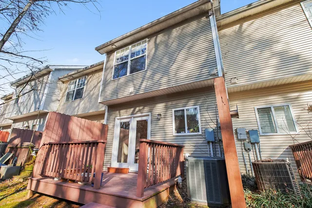 a view of a house with a wooden fence