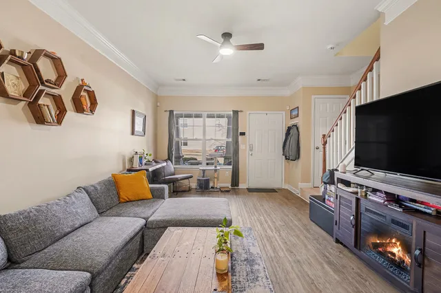 a living room with furniture and a flat screen tv