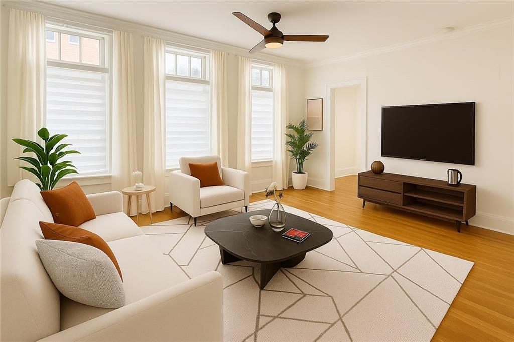 a living room with furniture and a flat screen tv