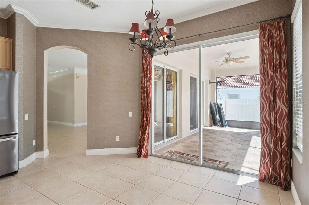 11450 Arborside Bend Way Windermere, FL 34786 - Photo 17 of 50 a view of a hallway with a chandelier and glass door