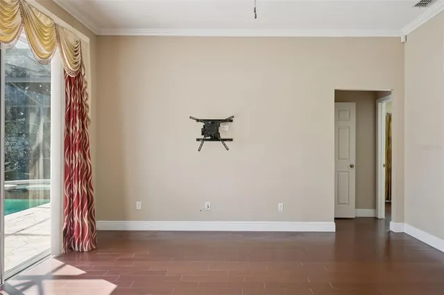 a view of a room with rack on the wall and a window