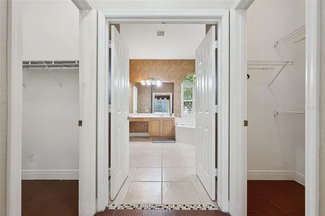a view of a hallway view with wooden floor and staircase