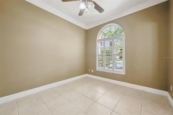 a view of an empty room with a window