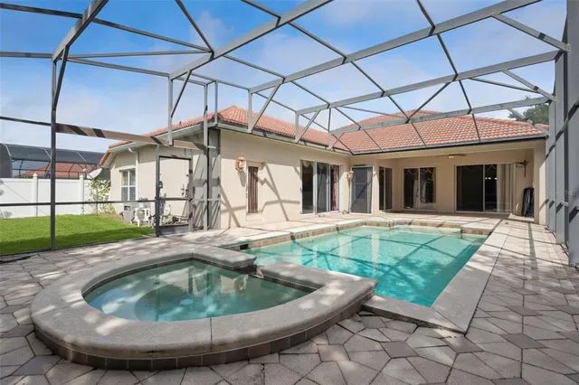 a view of a house with backyard