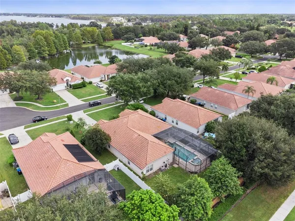 an aerial view of residential houses with outdoor space and street view