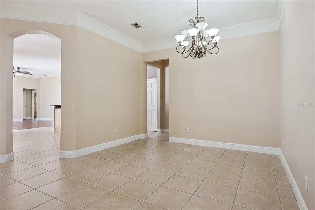 11450 Arborside Bend Way Windermere, FL 34786 - Photo 8 of 50 a view of an empty room with chandelier and bathroom