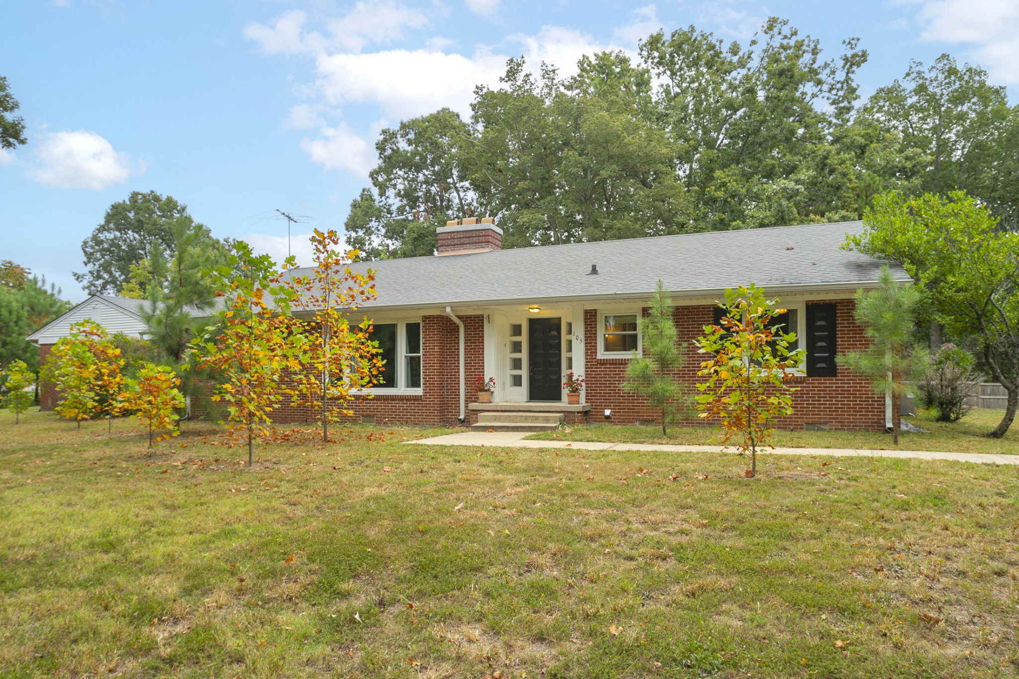 a front view of a house with a yard
