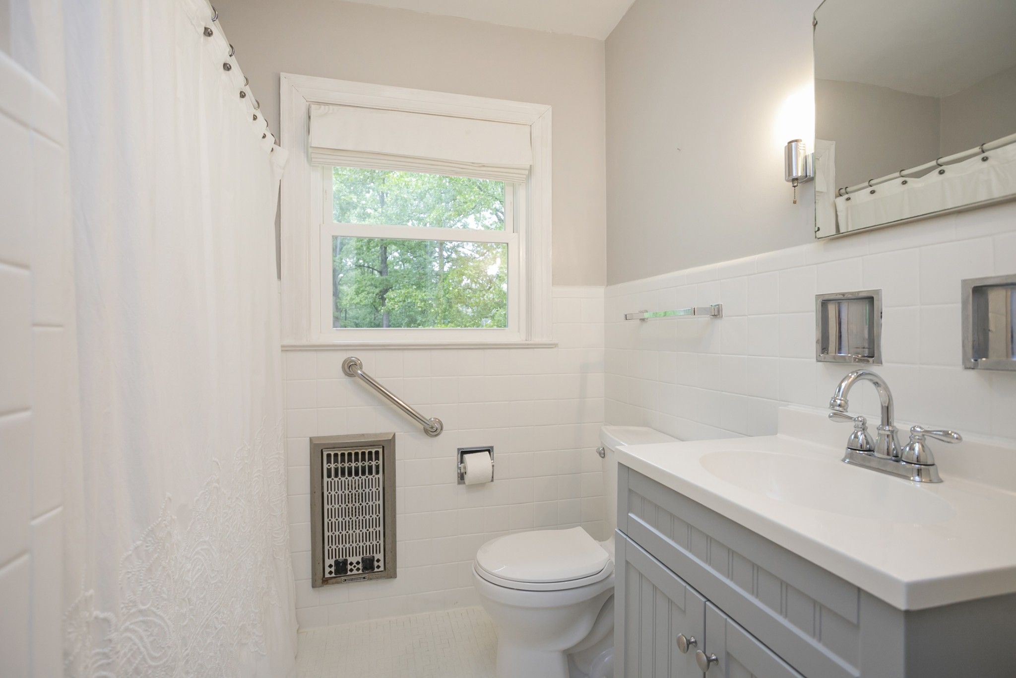 105 Echo Road Dickson, TN 37055 - Photo 11 of 32 a bathroom with a sink toilet and a window