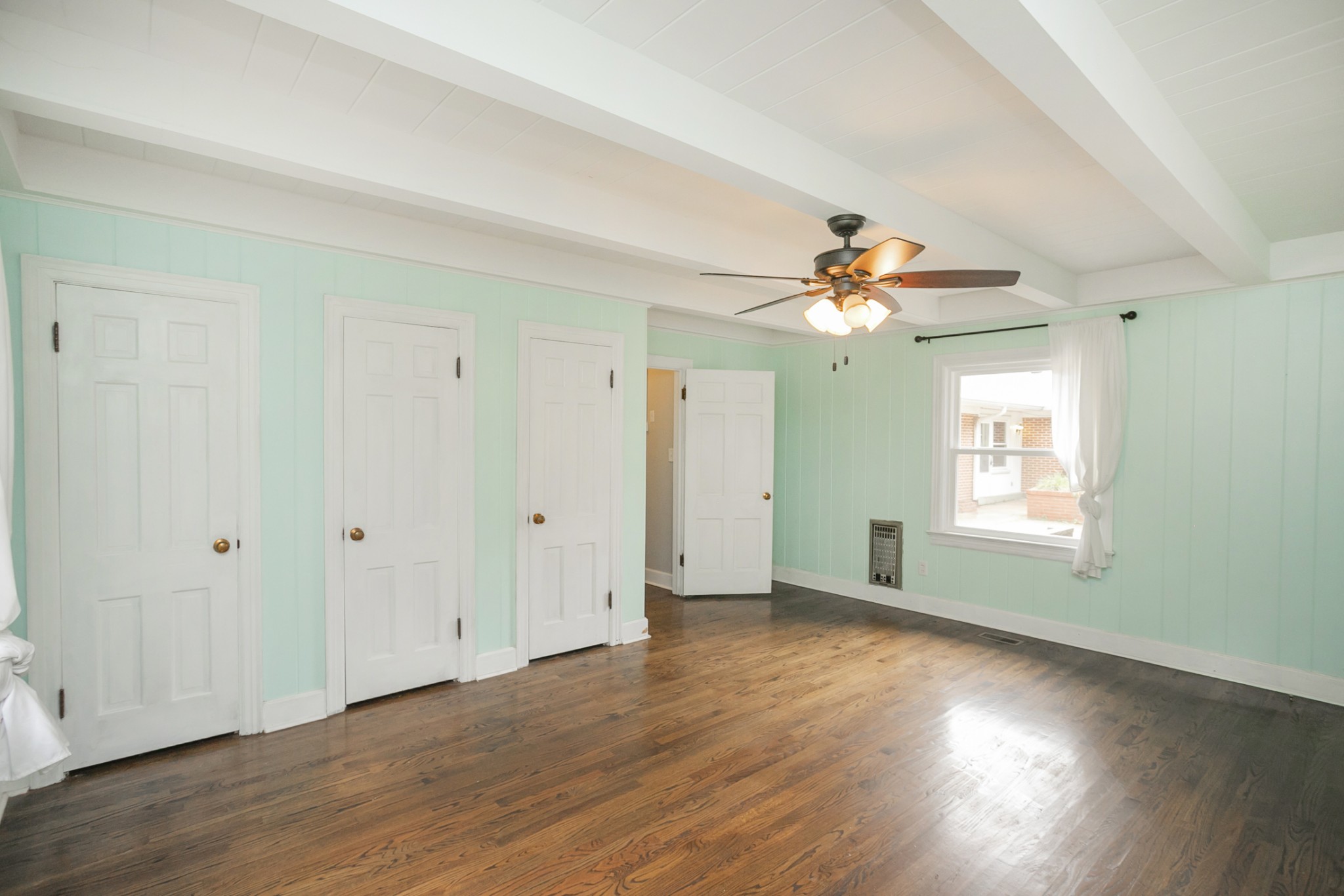105 Echo Road Dickson, TN 37055 - Photo 16 of 32 a view of an empty room with wooden floor and a window