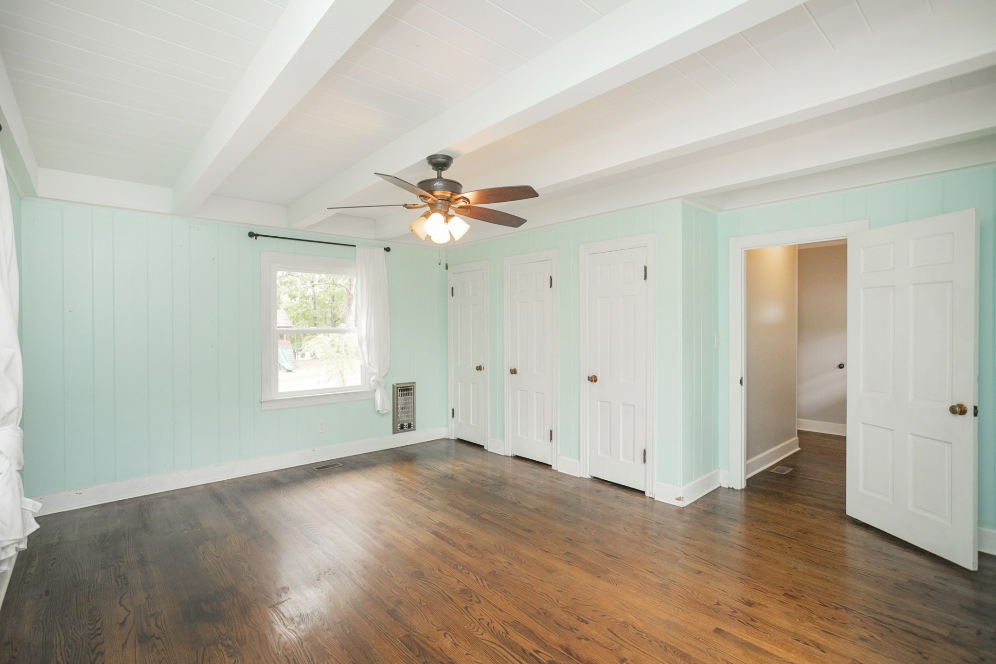 105 Echo Road Dickson, TN 37055 - Photo 17 of 32 an empty room with wooden floor and windows