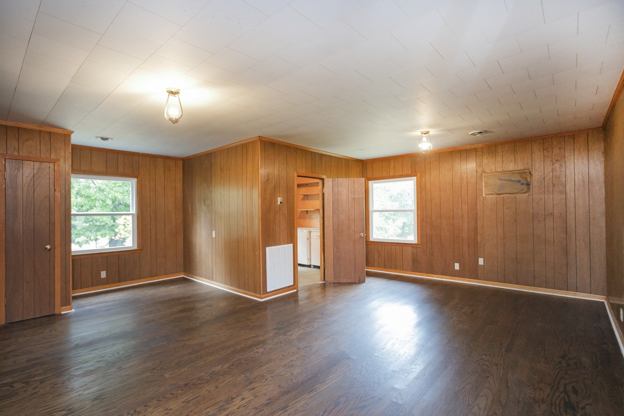 105 Echo Road Dickson, TN 37055 - Photo 21 of 32 a view of an empty room with wooden floor and a window