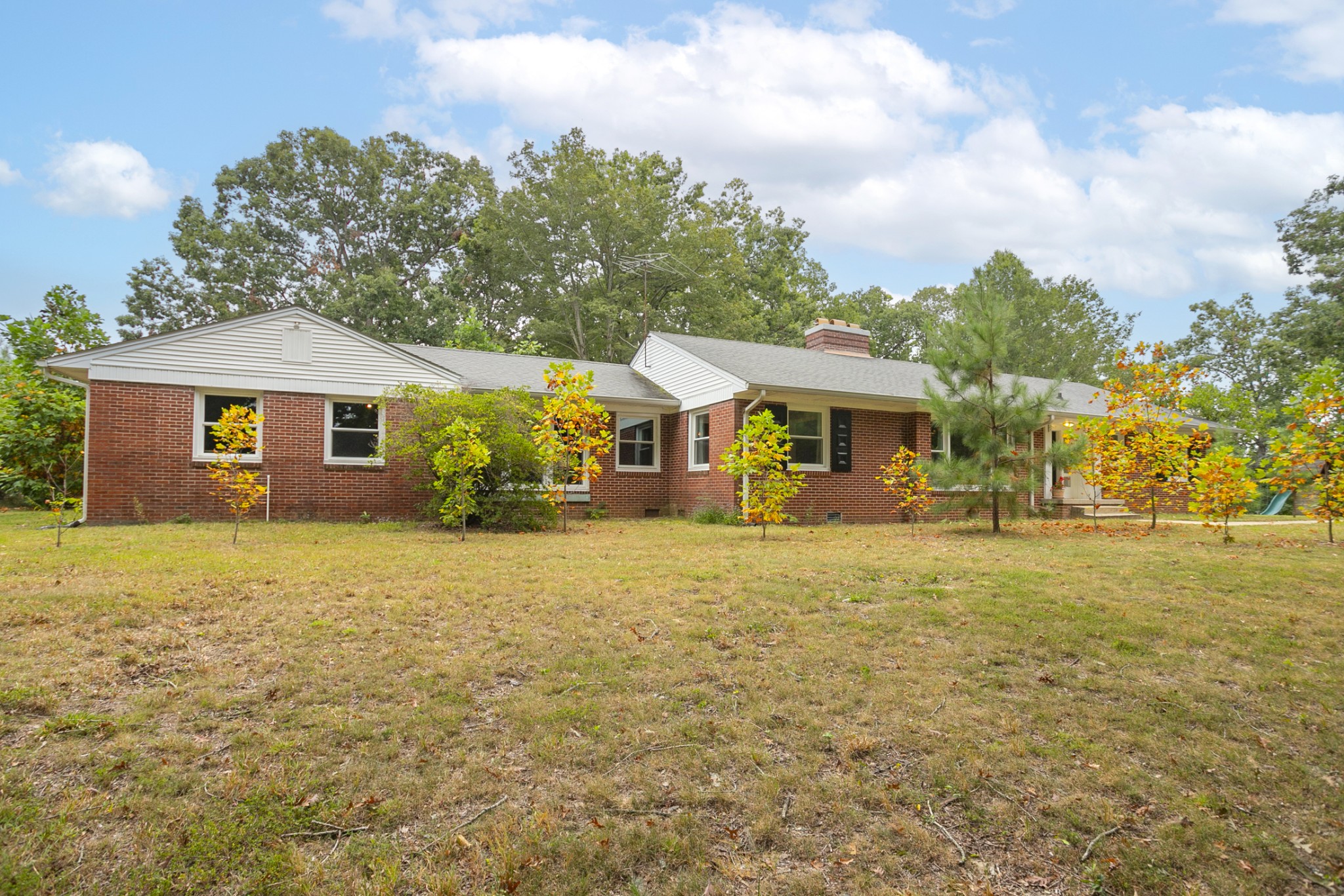 105 Echo Road Dickson, TN 37055 - Photo 22 of 32 a front view of a house with a garden
