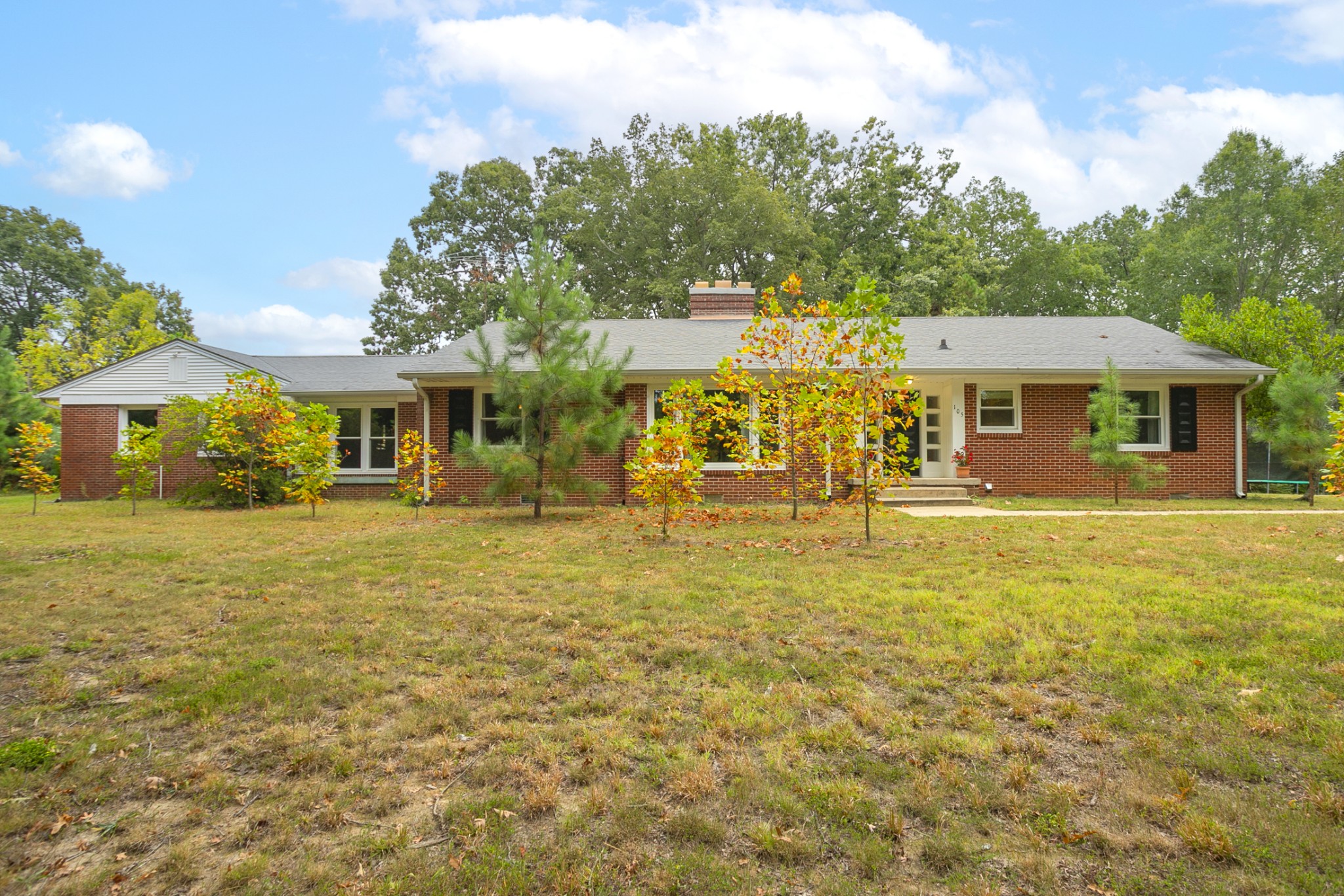 105 Echo Road Dickson, TN 37055 - Photo 32 of 32 a front view of a house with a garden