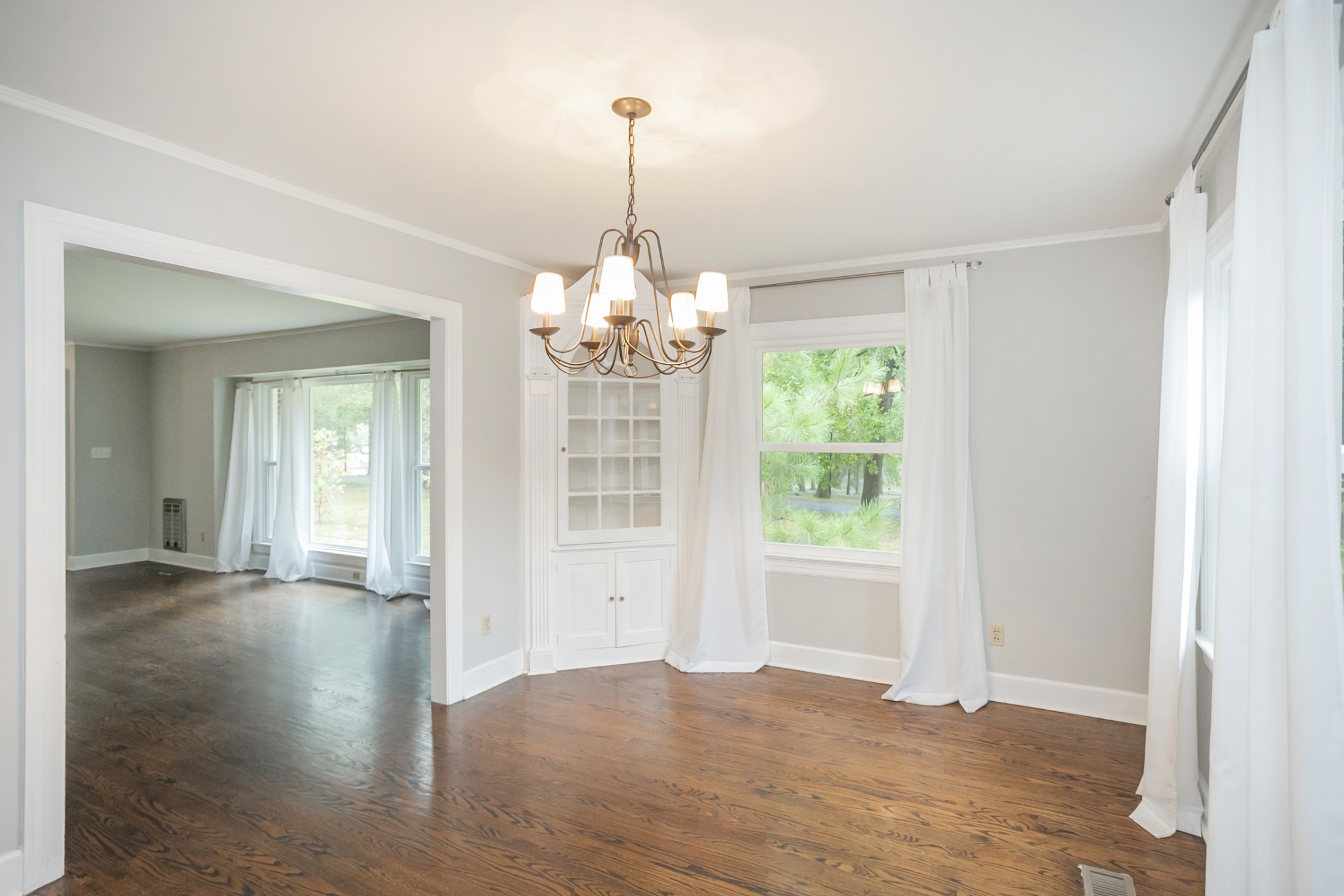 105 Echo Road Dickson, TN 37055 - Photo 5 of 32 a view of an empty room with wooden floor and a window