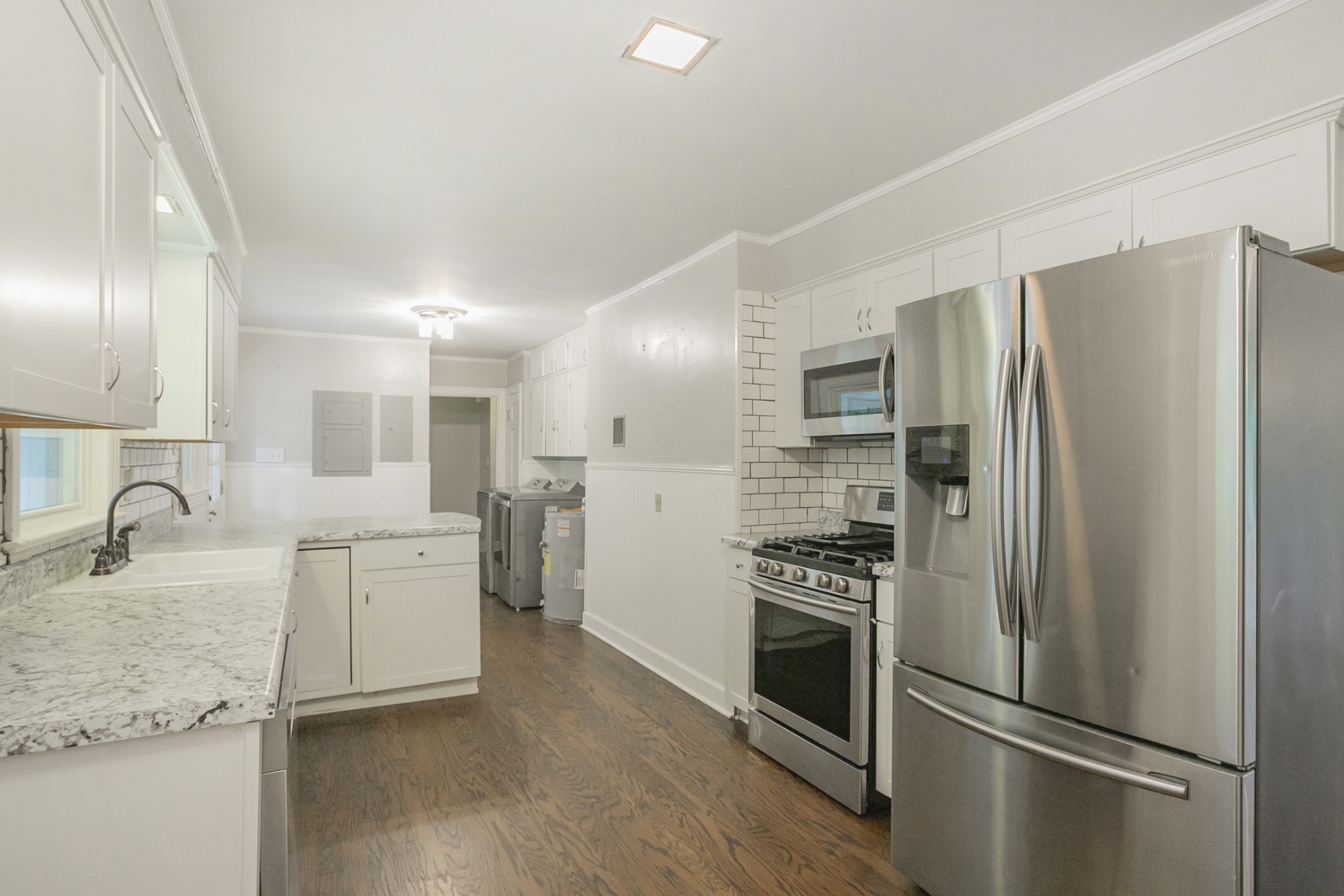105 Echo Road Dickson, TN 37055 - Photo 6 of 32 a kitchen with stainless steel appliances granite countertop a refrigerator and a stove top oven