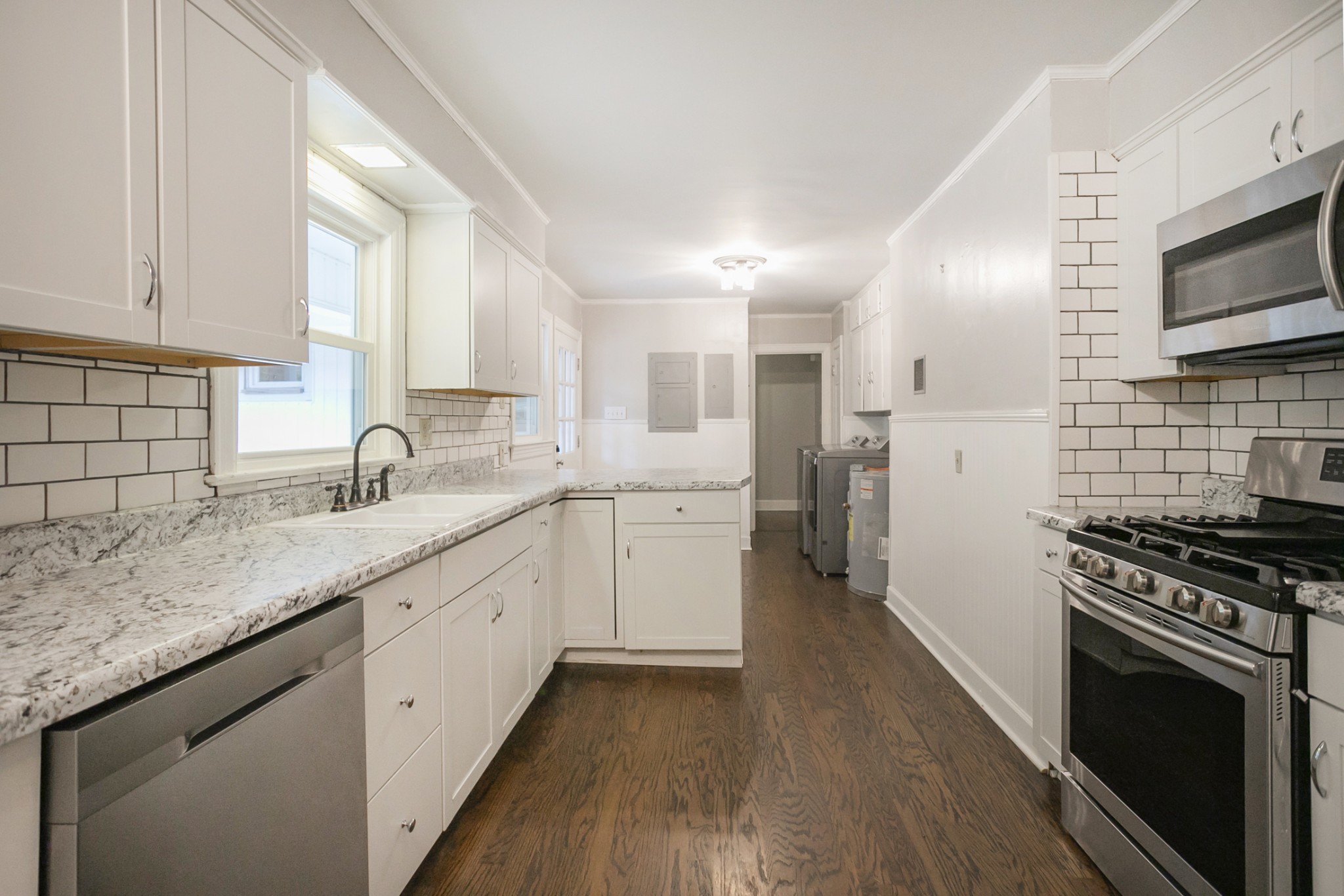 105 Echo Road Dickson, TN 37055 - Photo 7 of 32 a kitchen with granite countertop a sink stainless steel appliances and cabinets