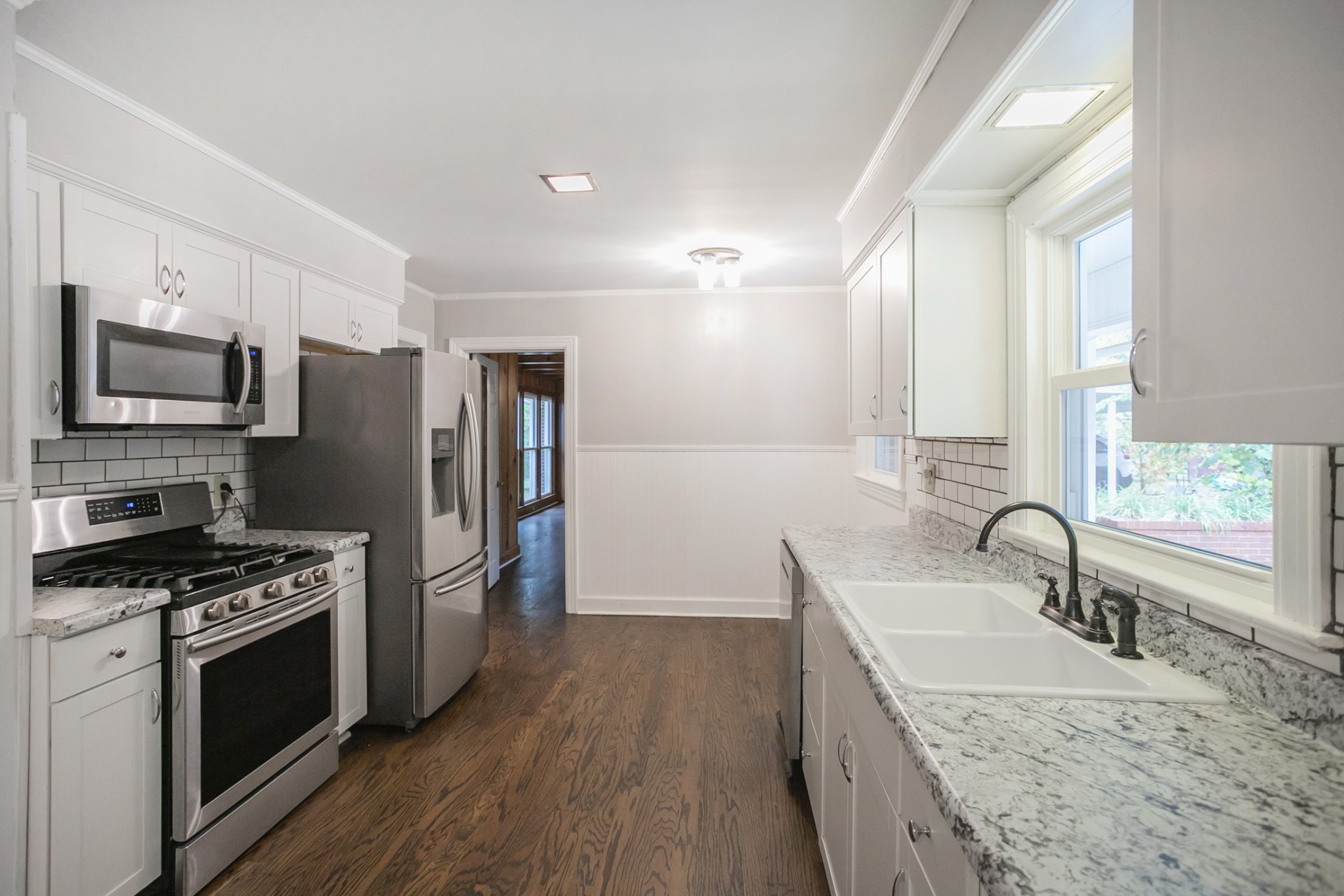 105 Echo Road Dickson, TN 37055 - Photo 8 of 32 a kitchen with stainless steel appliances granite countertop a sink stove and refrigerator