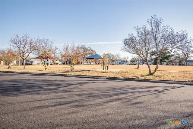 a view of road with trees