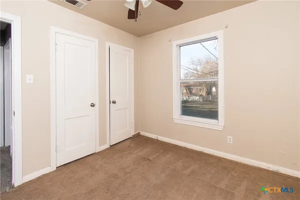 an empty room with windows