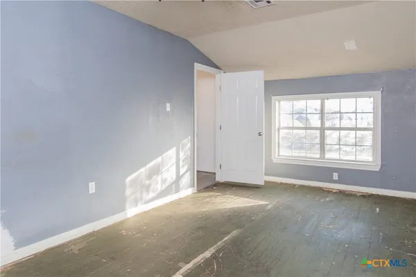 an empty room with windows
