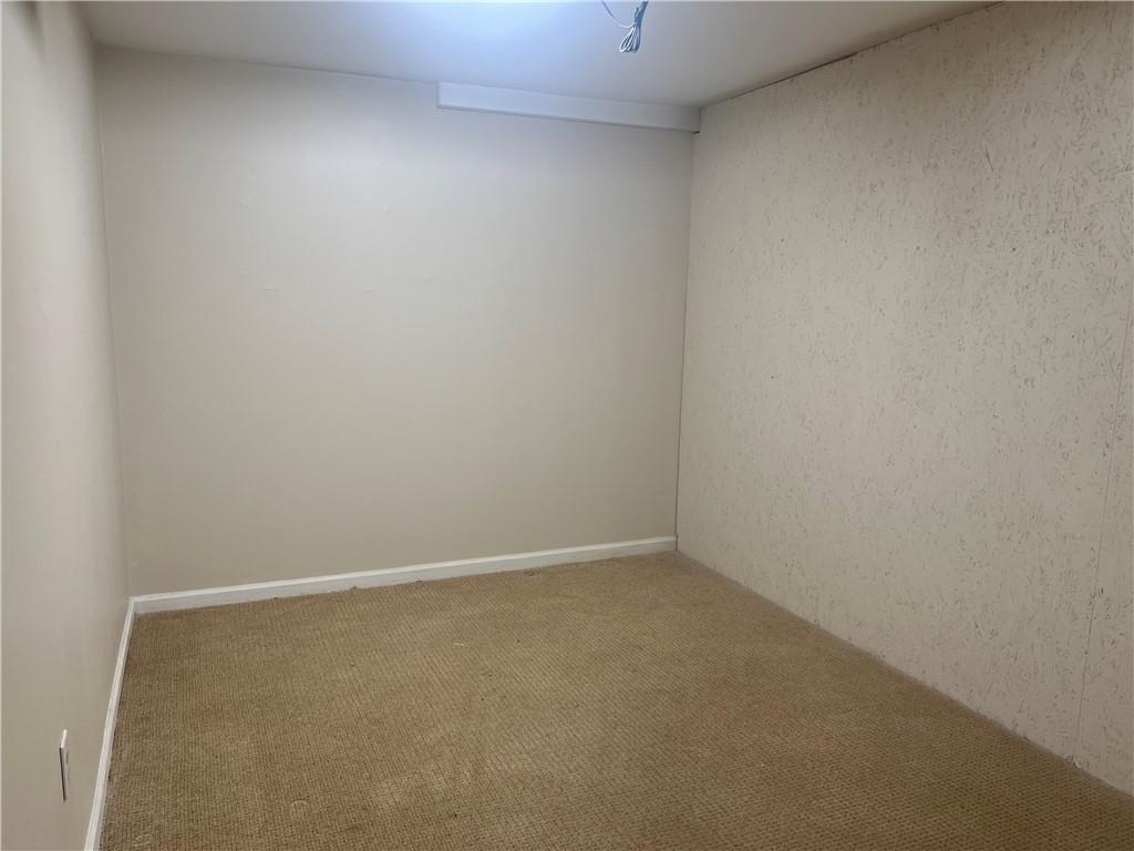 1725 Spindle Top Court Southwest Lilburn, GA 30047 - Photo 22 of 30 a view of an empty room