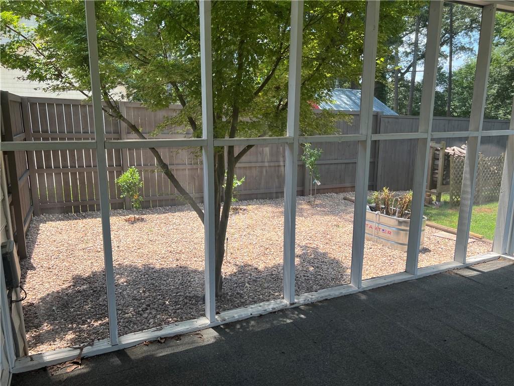 1725 Spindle Top Court Southwest Lilburn, GA 30047 - Photo 23 of 30 a view of a glass door and a yard