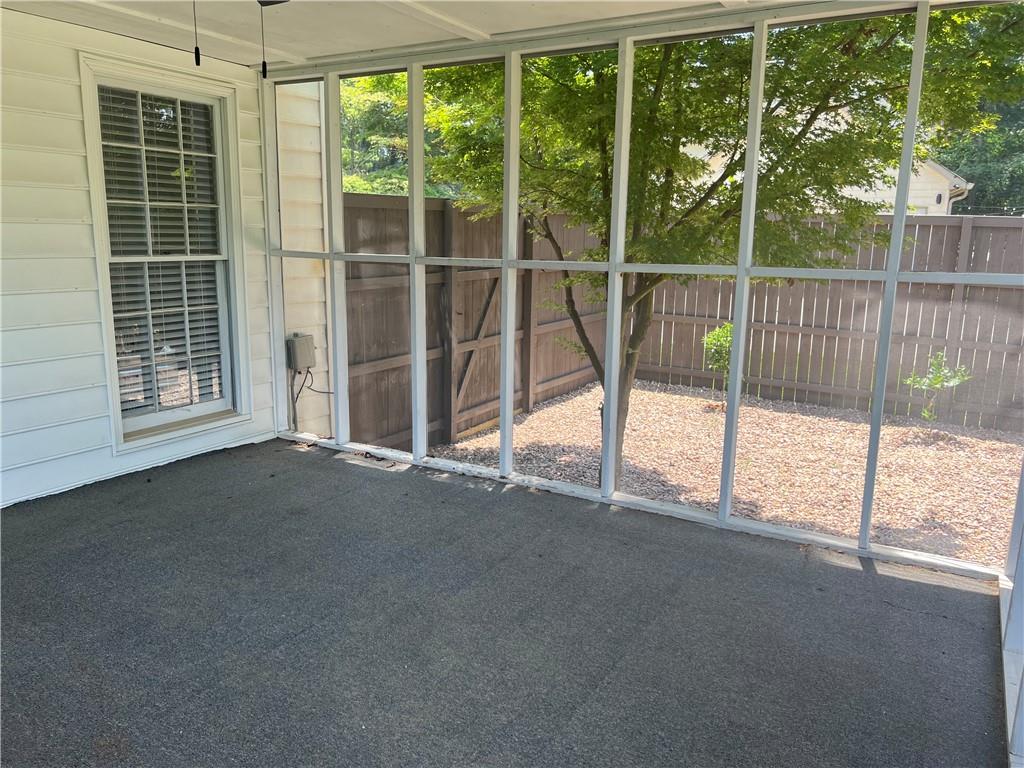 1725 Spindle Top Court Southwest Lilburn, GA 30047 - Photo 24 of 30 a view of empty room with floor to ceiling window