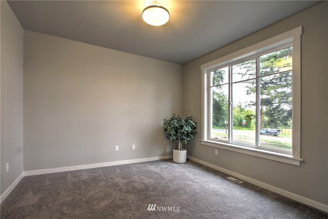 3304 Creswell Road, Unit 11 Snohomish, WA 98290 - Photo 11 of 18 an empty room with windows and flower in it