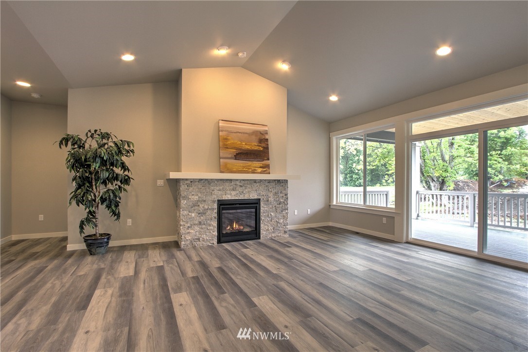 3304 Creswell Road, Unit 11 Snohomish, WA 98290 - Photo 7 of 18 a view of empty room with wooden floor and fan