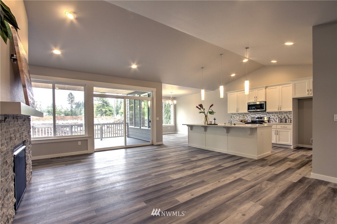 3304 Creswell Road, Unit 11 Snohomish, WA 98290 - Photo 8 of 18 a large kitchen with stainless steel appliances granite countertop a large center island and a large window
