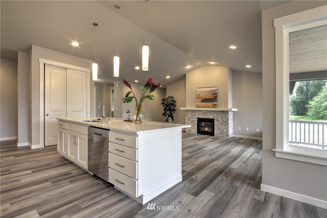 3304 Creswell Road, Unit 11 Snohomish, WA 98290 - Photo 9 of 18 a large kitchen with kitchen island a sink stainless steel appliances and cabinets