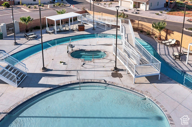 1329 Paseos Street Washington, UT 84780 - Photo 33 of 35 Community pool with a community hot tub and a patio