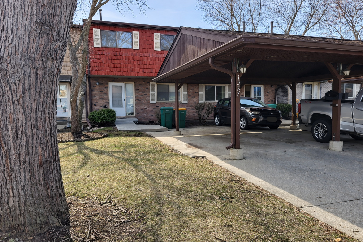 1527 Mohawk Trail Wheeling, IL 60090 - Photo 1 of 21 a view of a car park in front of house