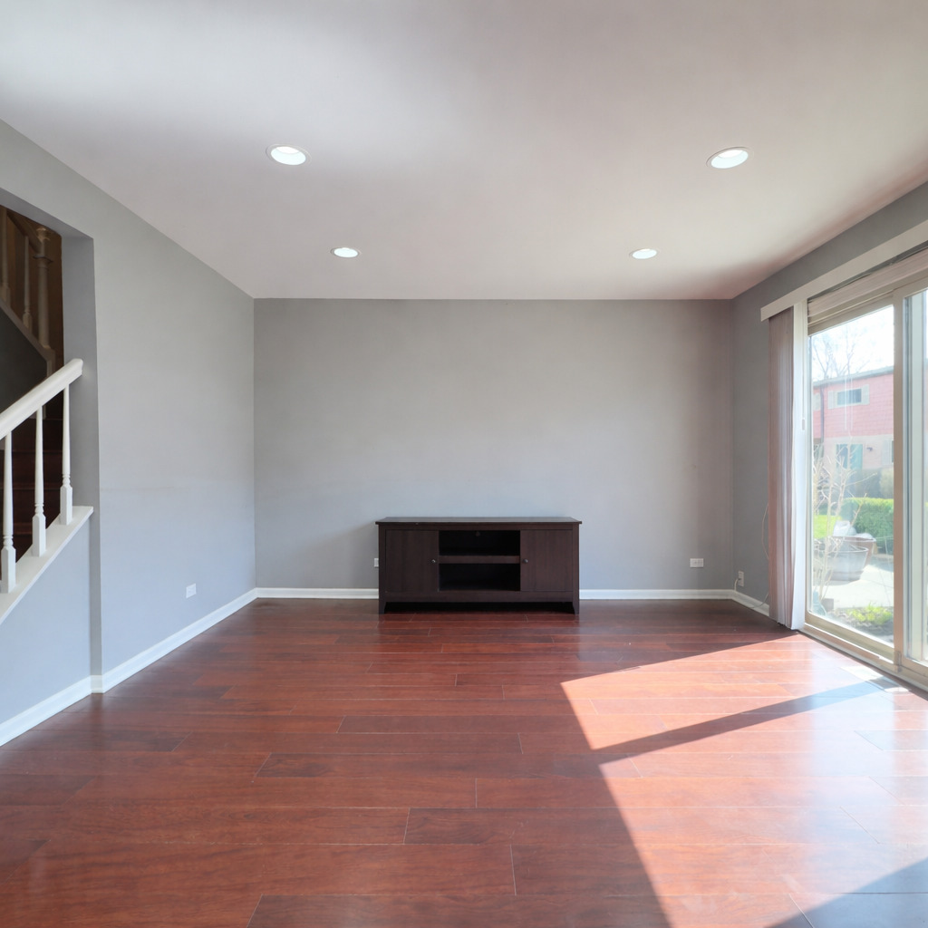 1527 Mohawk Trail Wheeling, IL 60090 - Photo 5 of 21 a view of an empty room with a window