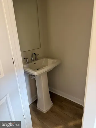 a bathroom with a sink and mirror