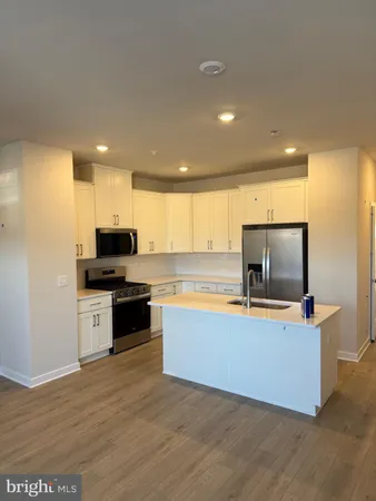 a living room with furniture and flat screen tv