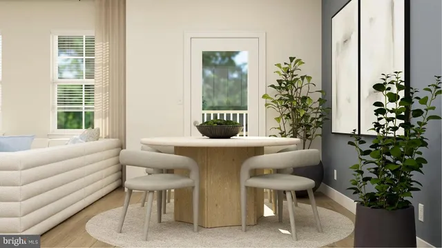 a living room with furniture potted plant and a window